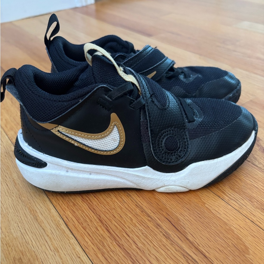 Nike Kids Black and White Sneakers with Gold Accents